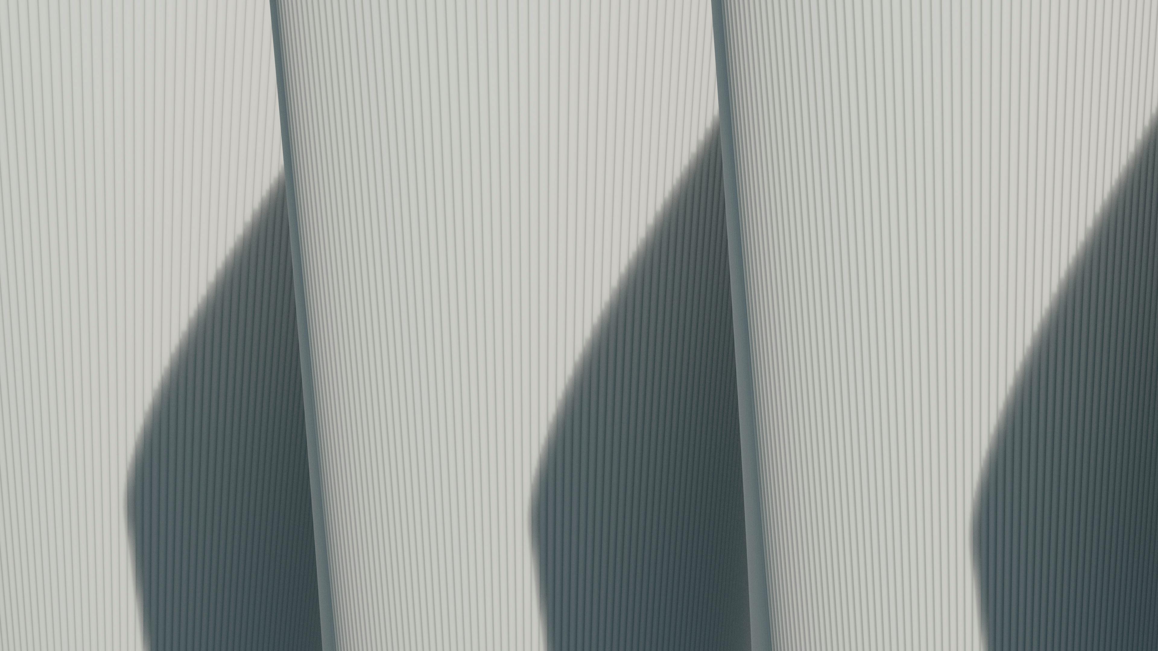 Abstract architectural image showcasing minimalist lines and strong shadows.